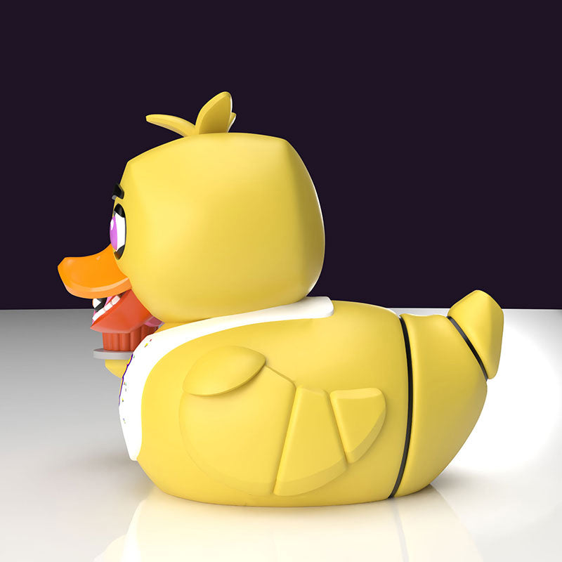 Side view of the Chica TUBBZ collectible with cupcake accessory