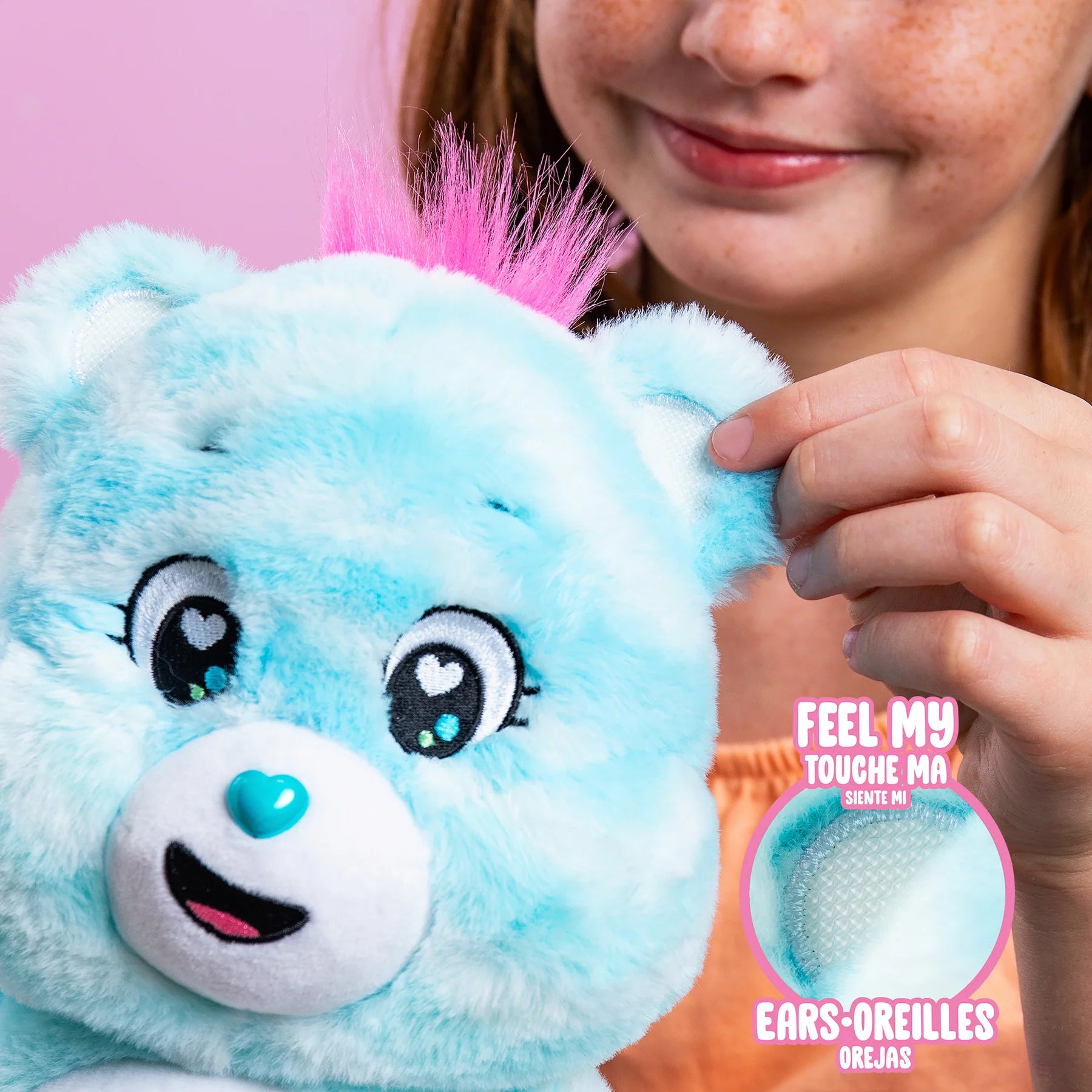 Cute child holds the Care Bear 14 Inch Plush Sweet Serenity Bear, showcasing its soft texture and calming features.