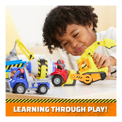 Child playing with Rubble's bulldozer and other construction vehicles