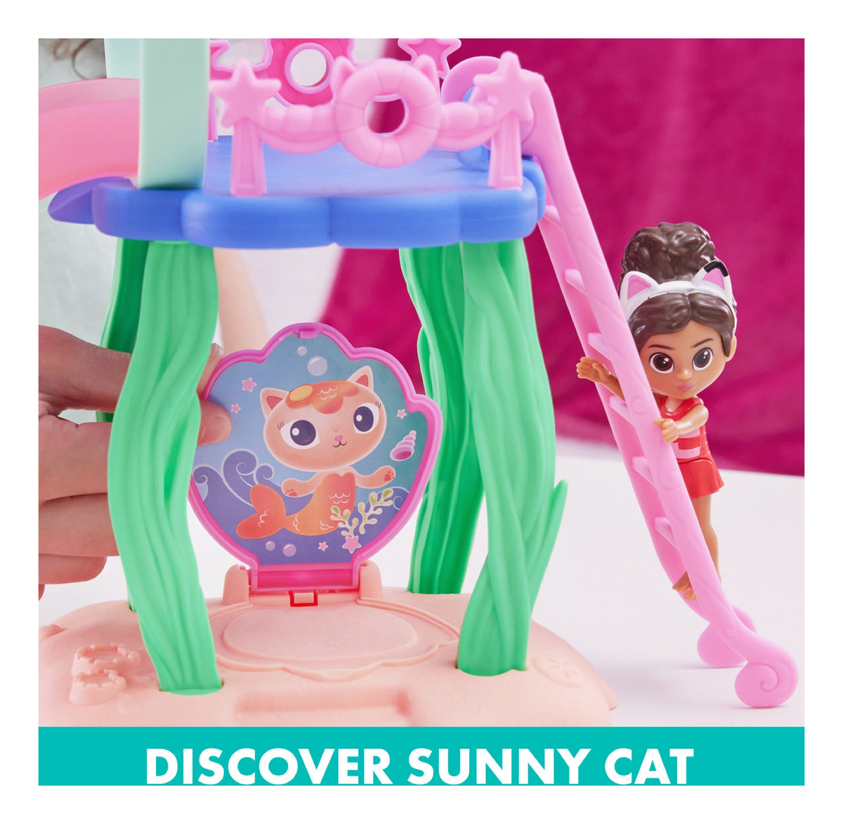 Gabby beside the pool playset's hidden Sunny Cat panel and ladder