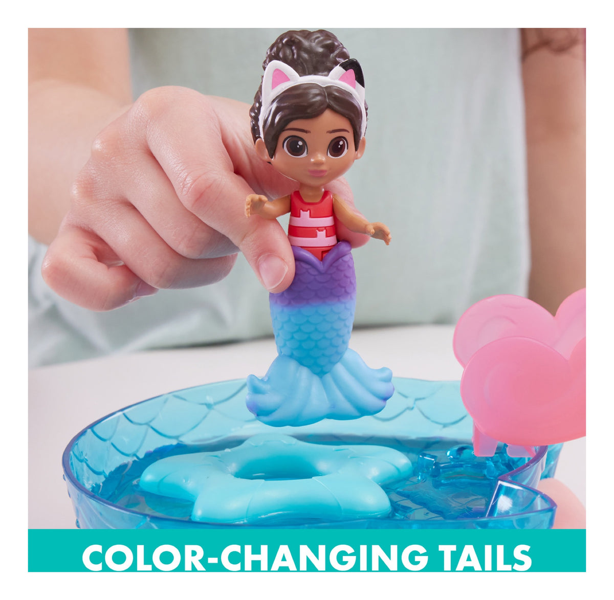 Gabby figure with colour-changing mermaid tail above the pool