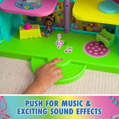 Child pressing the dollhouse button for music and sound effects