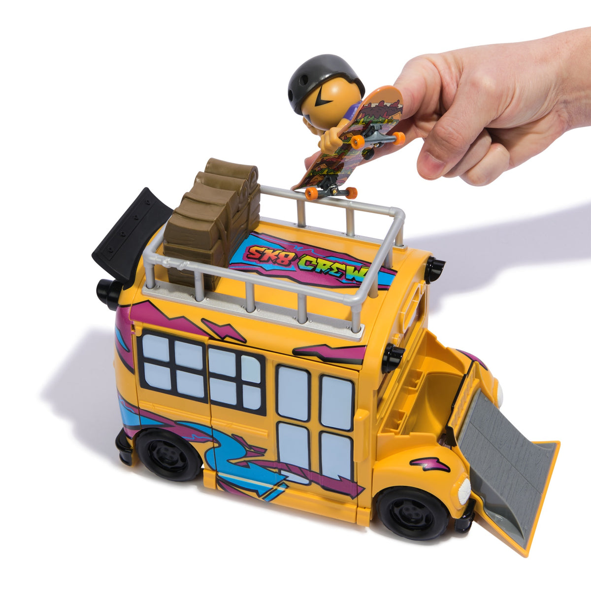 Skateboarder figure performing a trick on the yellow bus playset