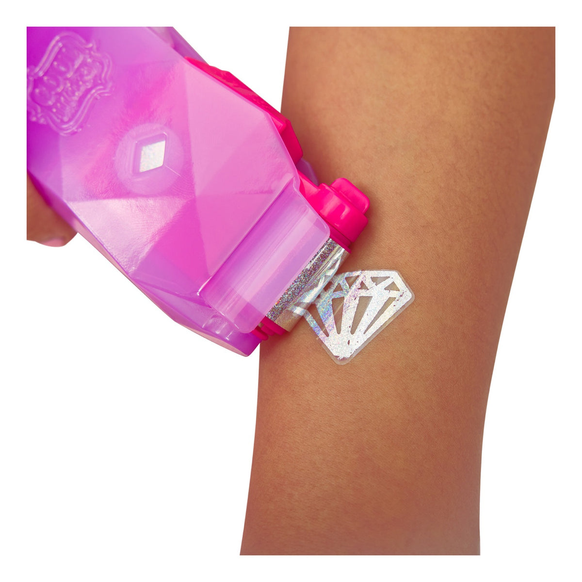 Pink Shimmer Me applicator rolling a silver diamond design onto an arm