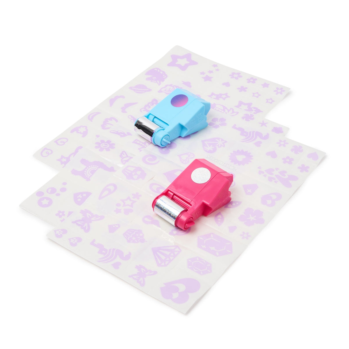 Blue and pink Shimmer Me foil rollers on patterned transfer sheets