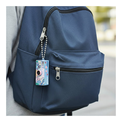 Disney Stitch mini keychain camera attached to a blue backpack