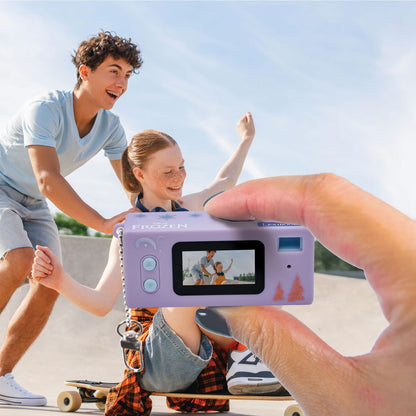 Frozen miniature digital camera being used to photograph skateboarders