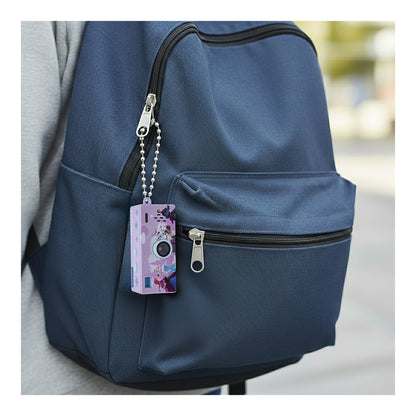 Frozen miniature digital camera keyring attached to a blue backpack