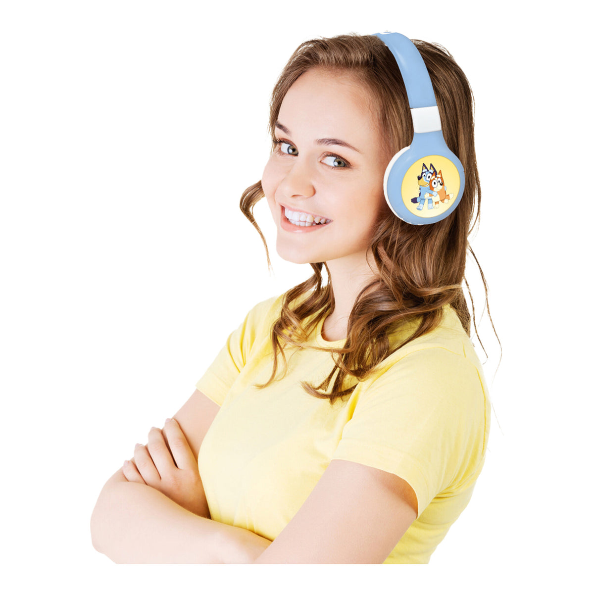 Girl wearing blue Bluey headphones against a white background