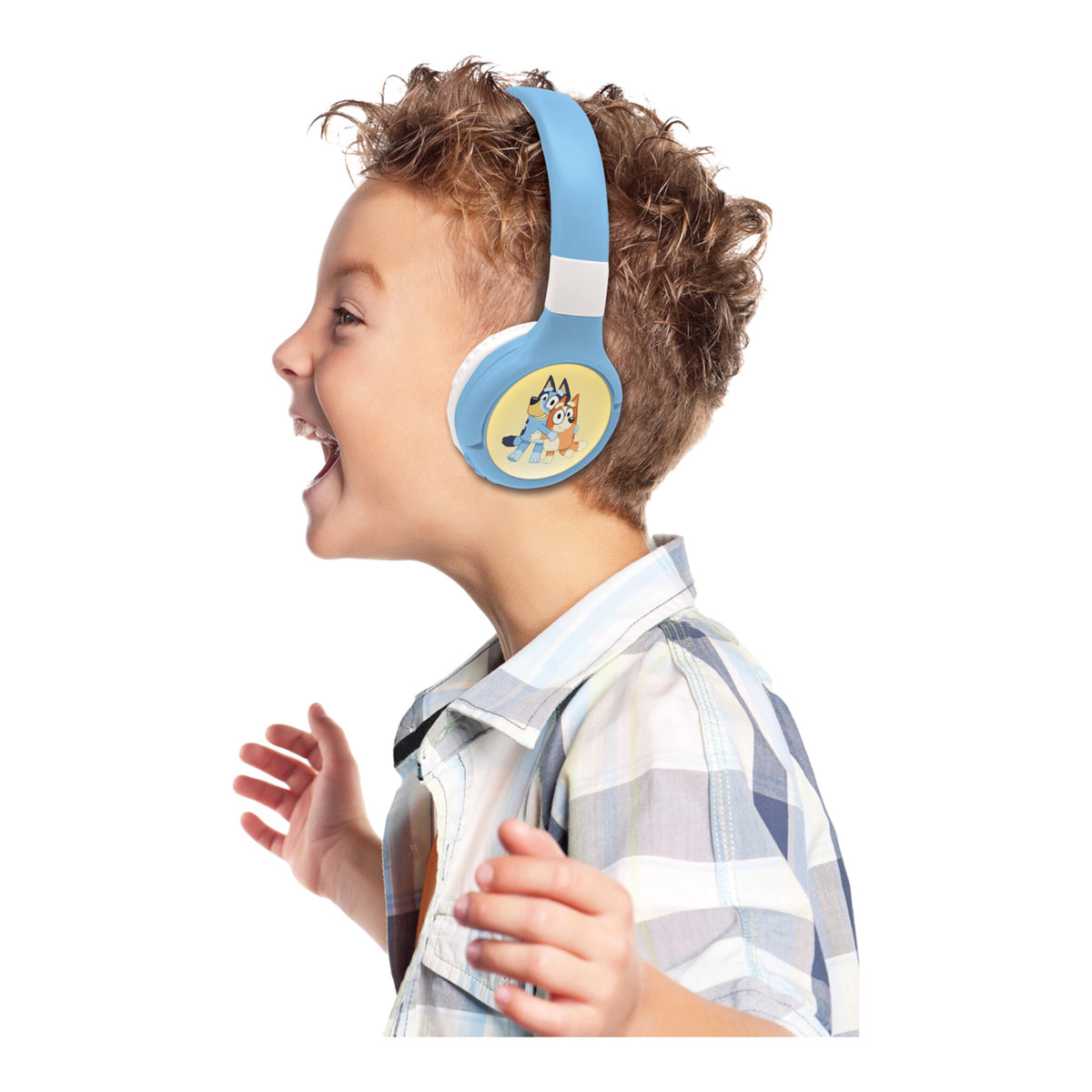 Young boy wearing Bluey headphones in side profile