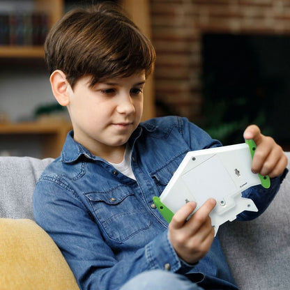 Child holding the Toy Story Cyber Arcade Motion console while seated