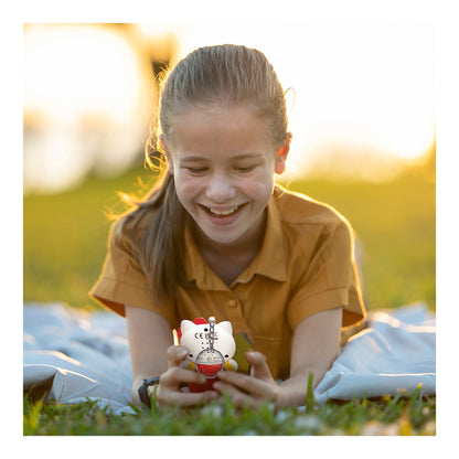 Girl playing with the Hello Kitty virtual pet game outdoors