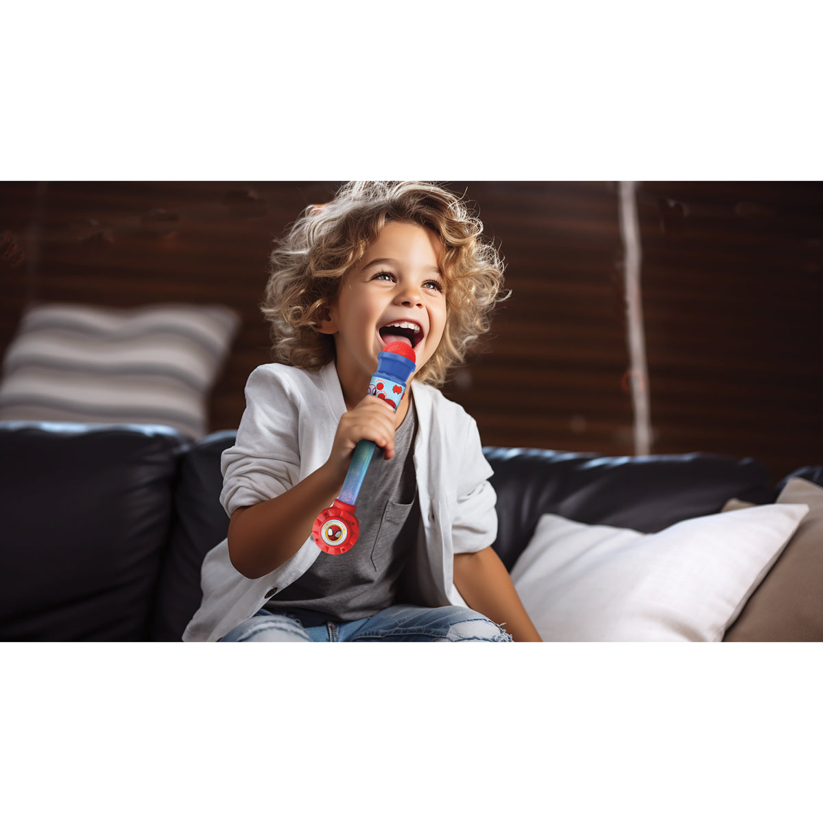 Child singing with the Spider-Man light-up microphone at home