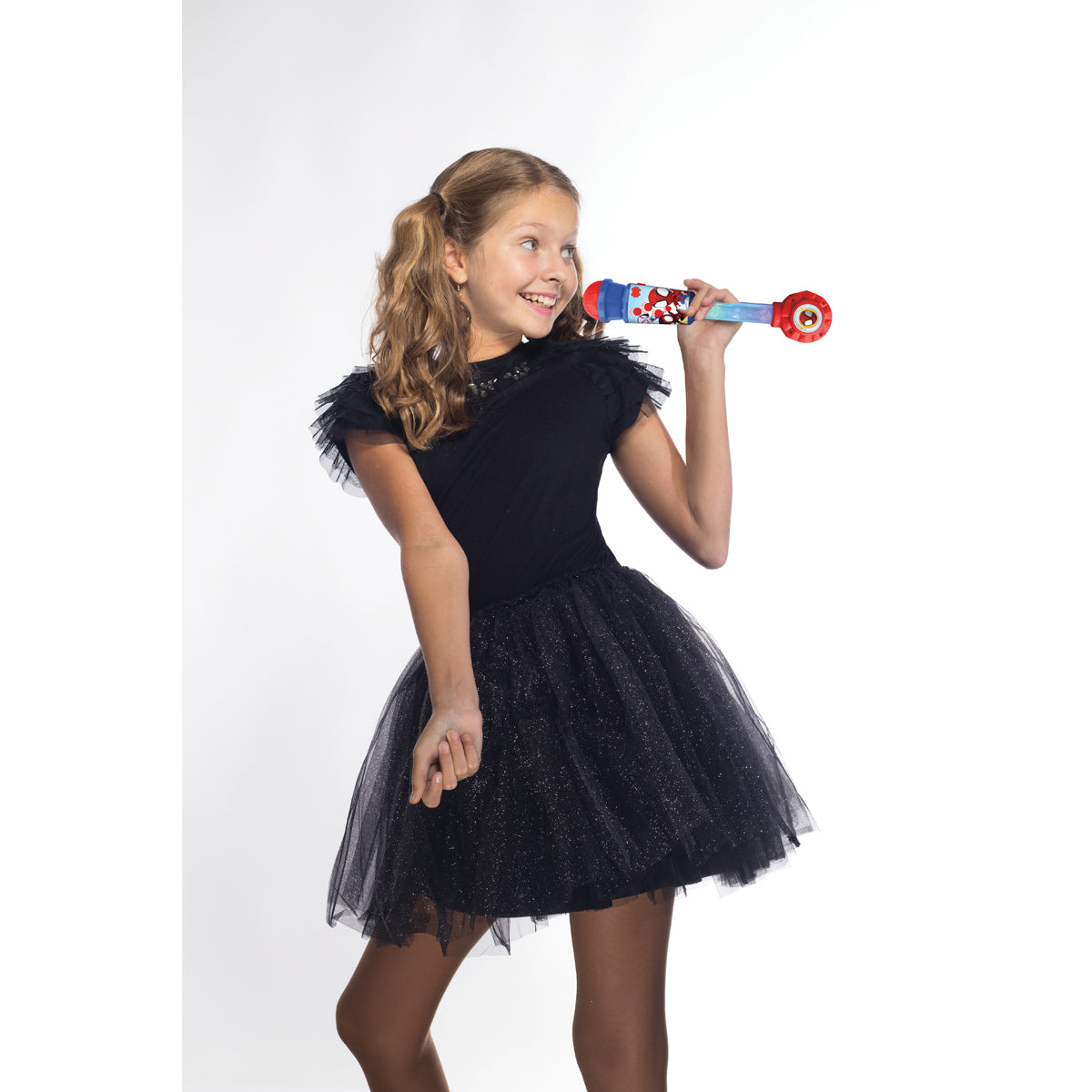 Girl holding the Spider-Man light-up microphone