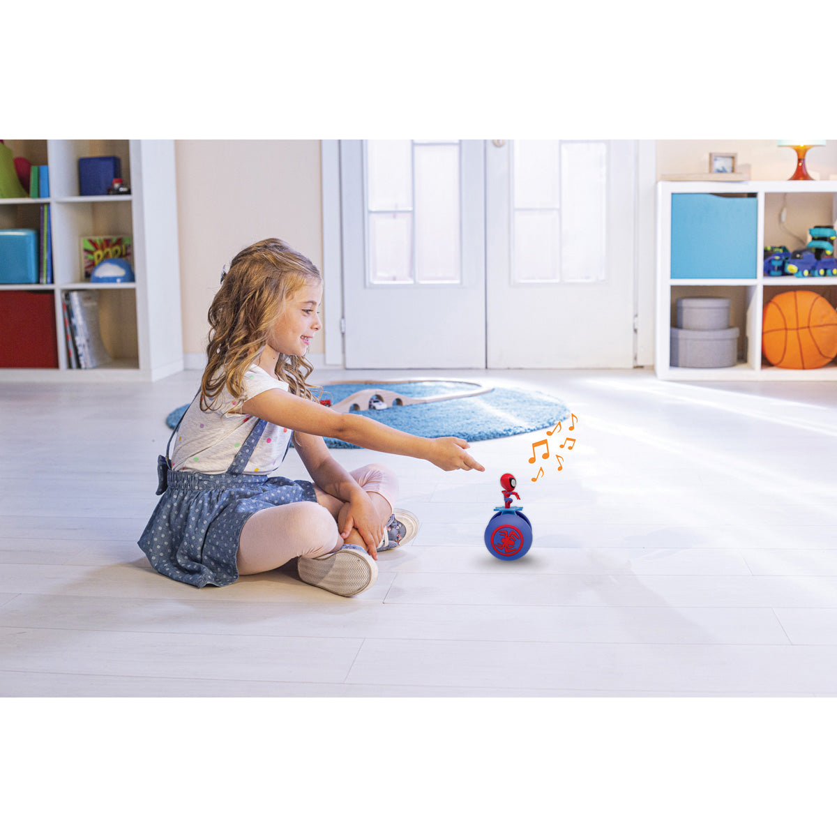 Child playing with the Spider-Man My Sliding Buddy robot