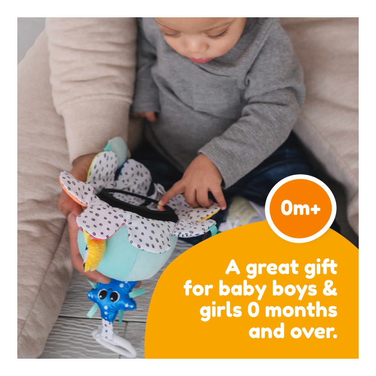 Baby exploring the mirror on the Salty Sam sensory toy