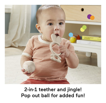 Baby using the Sensimals bunny teether and jingle toy