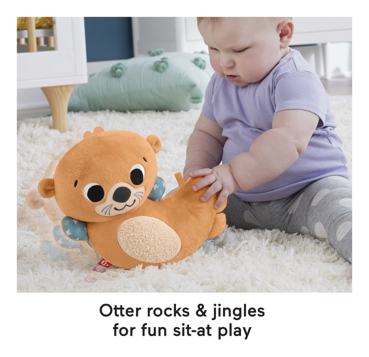 Baby playing with the rocking and jingling otter plush toy